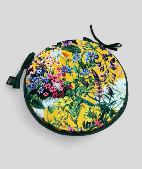Luxury circular, yellow coloured velvet bistro seat pads with a multicoloured floral print