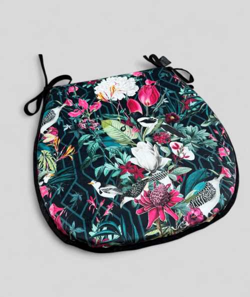Classic D shaped tropical, multicoloured printed velvet seat pads on a black background
