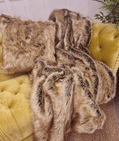 Luxury long-haired beige and brown faux fur sofa throw