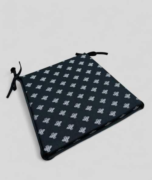 Black tapered chair cushion with a silver foil small bee design