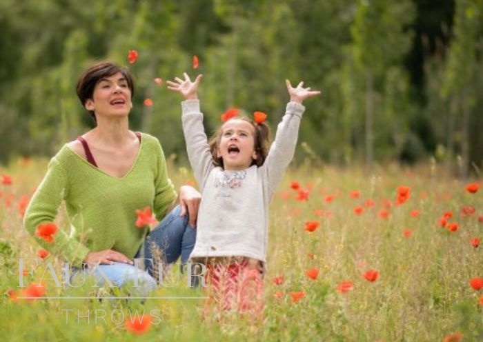 mother-and-daughter-playing-in-the-meadow cropped